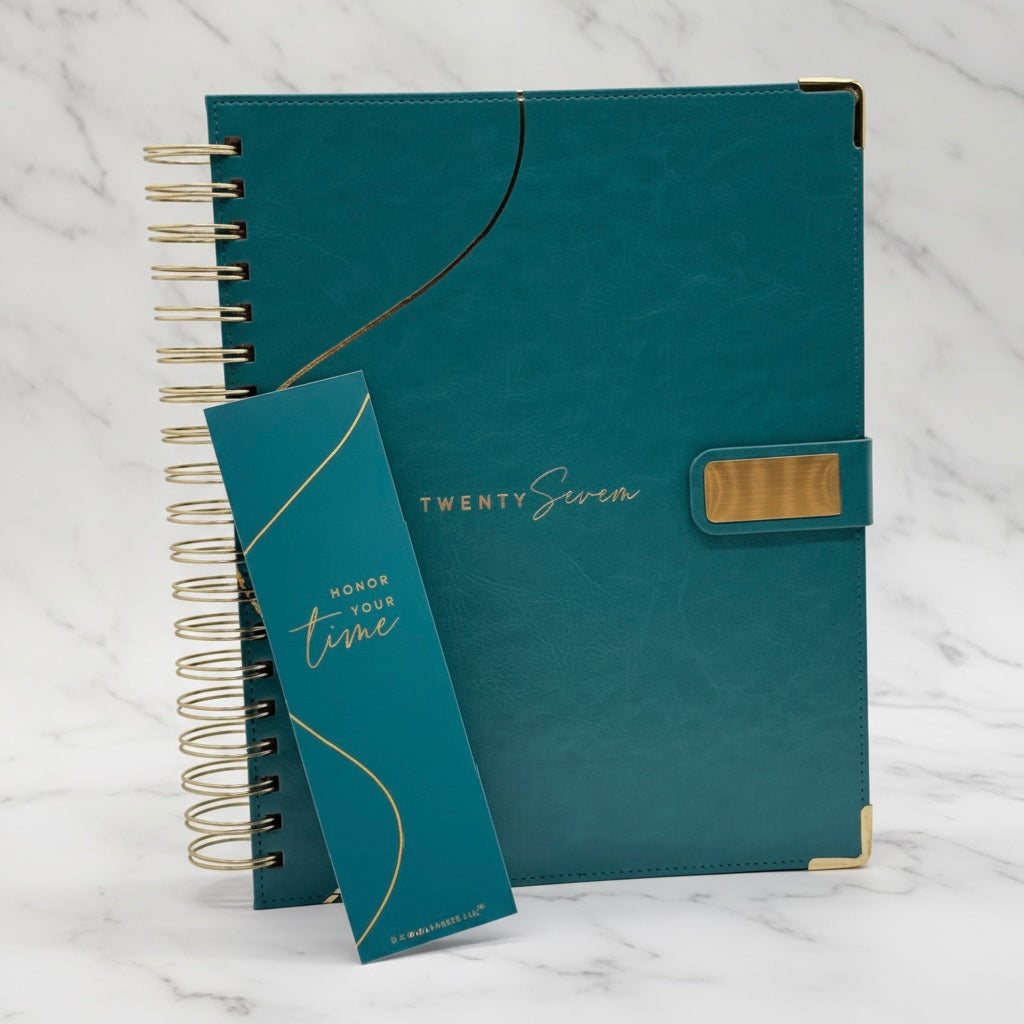 2027 Planner, teal color, closed cover showcasing PU leather finish, reinforced corners, magnetic closure, coil binding, and teal bookmark.- Full Marble background.